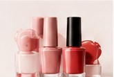 Nail polish bottles in blush, red and clear finishes